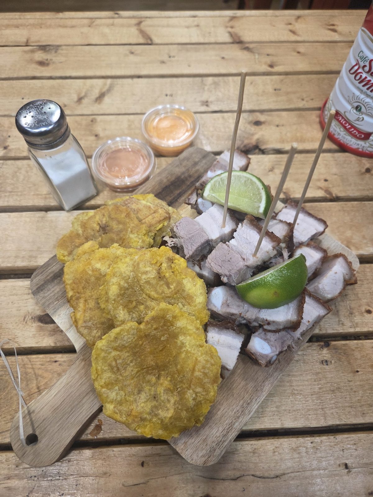 Tostones and chicharrón on a board
